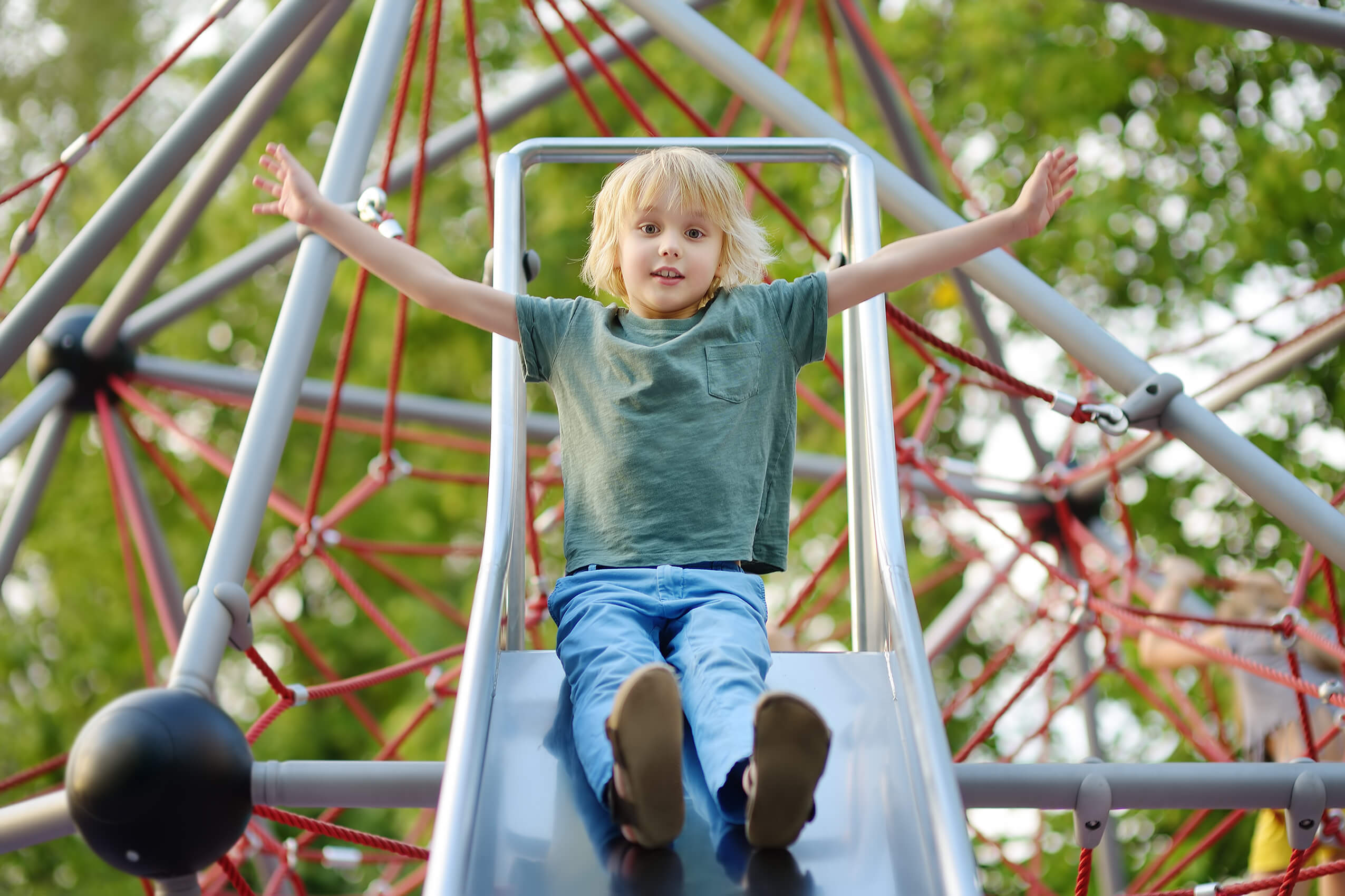 kid sliding down slide
